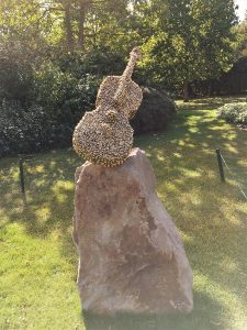 Bill Woodrow’s sculpture is thousands of bees covering a violin. 