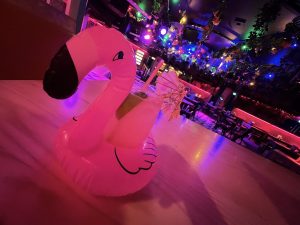 Cocktail Served with Inflatable Flamingo at Barrio Bars