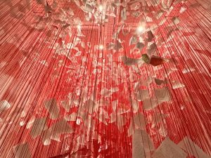 Hand-Written Letters and Red Woollen Threads Cascading from the Ceiling - Chiharu Shiota- Threads of Life Exhibition London
