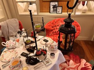 Cakes on a Spiral Staircase a Hanging Lamp Serving Scones at The Phantom of the Opera Afternoon Tea