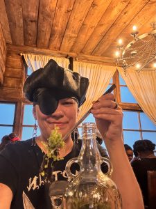 Planting Plants Inside a Kraken Rum Bottle While Dressed as a Pirate at The Rhum Tavern London