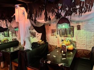 Tables with Spooky Halloween Decoration at The Haunting on Russel Street Pop-Up Halloween Bar